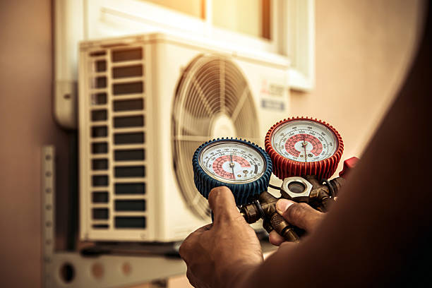 Professional Air Conditioning Service technician working in West Roxbury, MA
